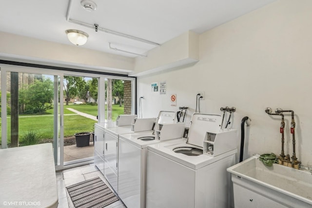 1111 Pleasant Run Dr Unit 905, Wheeling, IL 60090 - shared laundry room with washing machine and dryer and light tile patterned floors