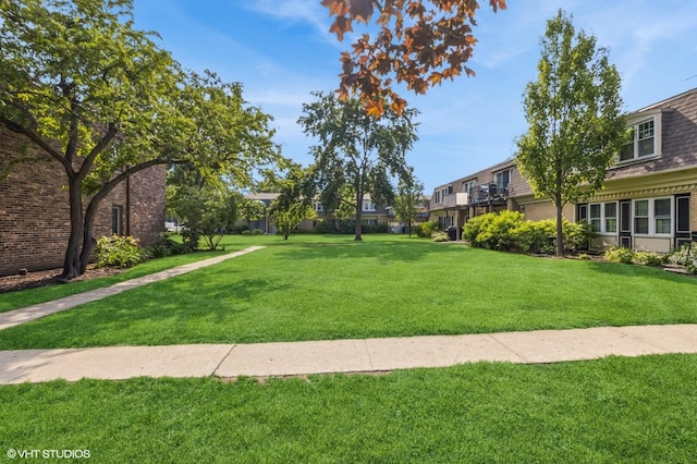 1111 Pleasant Run Dr Unit 905, Wheeling, IL 60090 - view of property's community with a yard and a residential view