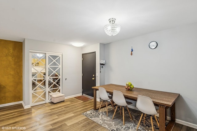 1111 Pleasant Run Dr Unit 905, Wheeling, IL 60090 - dining area with light wood-style floors and a chandelier