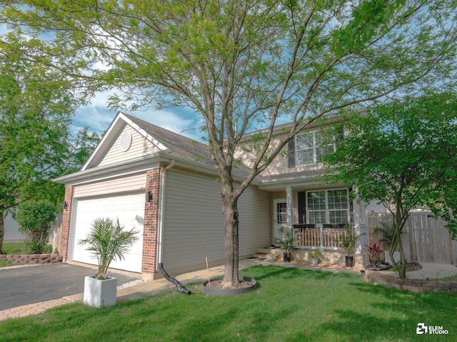424 Grape Vine Trl, Oswego, IL 60543 - view of front of house featuring a garage, a porch, asphalt driveway, a front lawn, and brick siding