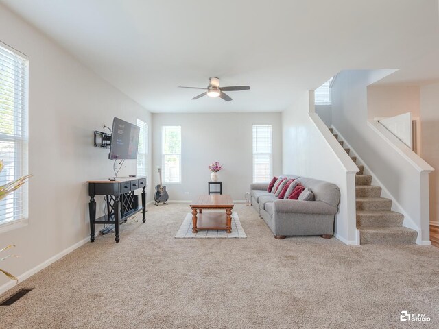 424 Grape Vine Trl, Oswego, IL 60543 - carpeted living room featuring stairs and a ceiling fan
