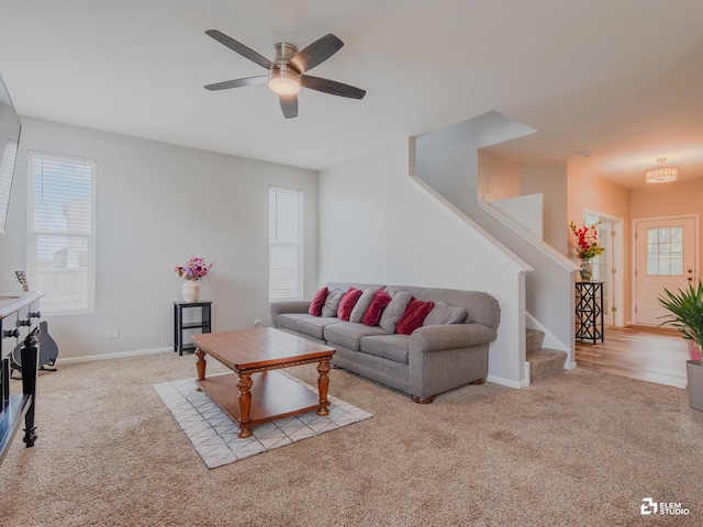 424 Grape Vine Trl, Oswego, IL 60543 - carpeted living area featuring a ceiling fan and stairway