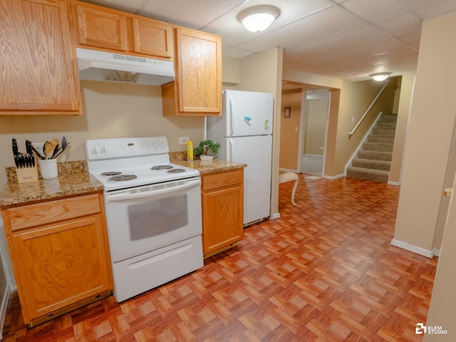 424 Grape Vine Trl, Oswego, IL 60543 - kitchen featuring under cabinet range hood, white appliances, a drop ceiling, and light stone counters