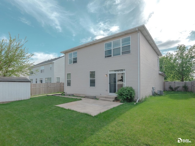 424 Grape Vine Trl, Oswego, IL 60543 - back of property with a fenced backyard, a patio, a storage shed, and entry steps