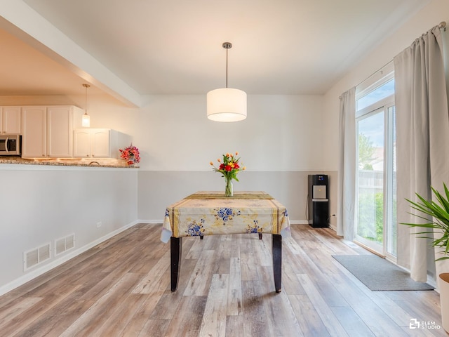 424 Grape Vine Trl, Oswego, IL 60543 - dining room featuring plenty of natural light and light wood-style flooring