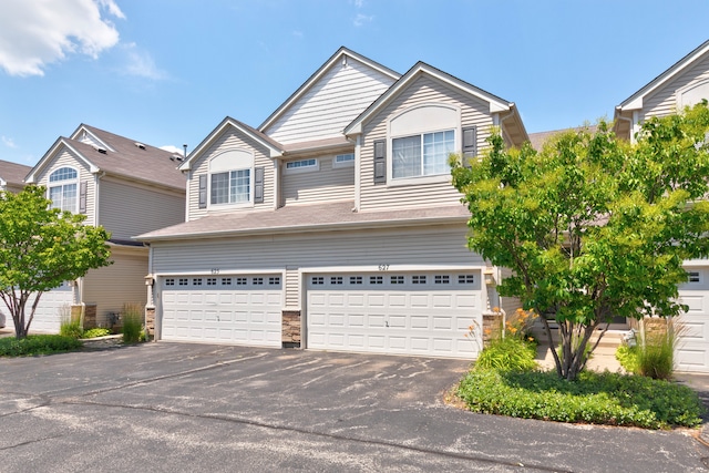 627 S Jade Ln, Round Lake, IL 60073 - view of front of house with an attached garage and driveway