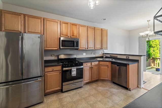 627 S Jade Ln, Round Lake, IL 60073 - kitchen with stainless steel appliances, a peninsula, dark countertops, a chandelier, and recessed lighting