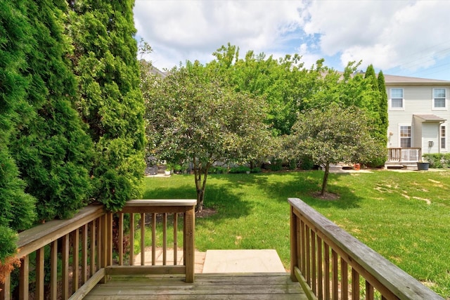 627 S Jade Ln, Round Lake, IL 60073 - wooden deck featuring a lawn
