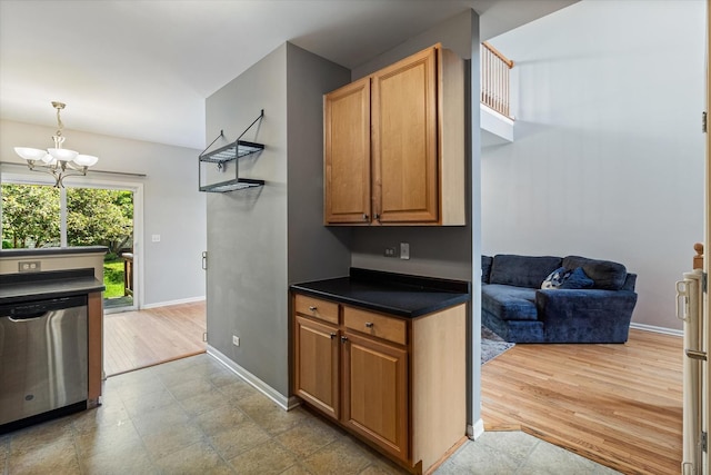 627 S Jade Ln, Round Lake, IL 60073 - kitchen with dishwasher, a chandelier, dark countertops, and pendant lighting
