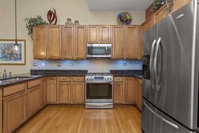 1780 Briarheath Dr, Aurora, IL 60505 - kitchen featuring stainless steel appliances, brown cabinets, backsplash, and light wood-type flooring