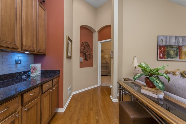 1780 Briarheath Dr, Aurora, IL 60505 - hallway with light wood-style floors and arched walkways