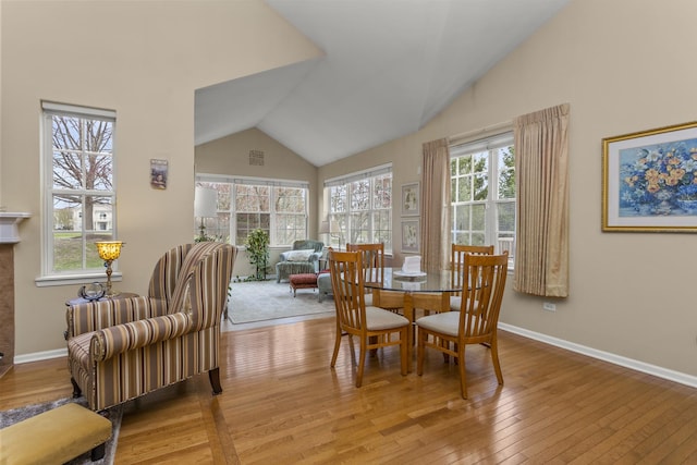 1780 Briarheath Dr, Aurora, IL 60505 - dining space featuring high vaulted ceiling and wood-type flooring
