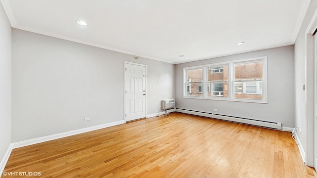4629 Main St Unit 2A, Skokie, IL 60076 - spare room featuring a baseboard heating unit, ornamental molding, light wood-style floors, and recessed lighting