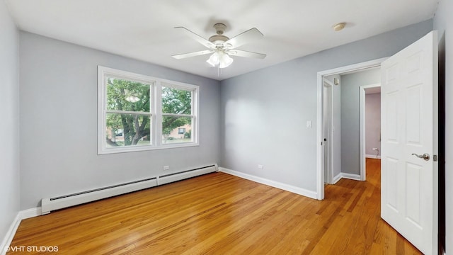 4629 Main St Unit 2A, Skokie, IL 60076 - spare room with a baseboard heating unit, light wood-style floors, a ceiling fan, and a smoke detector