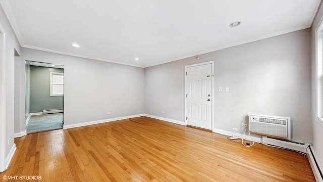 4629 Main St Unit 2A, Skokie, IL 60076 - empty room with baseboard heating, crown molding, light wood-type flooring, a wall unit AC, and recessed lighting