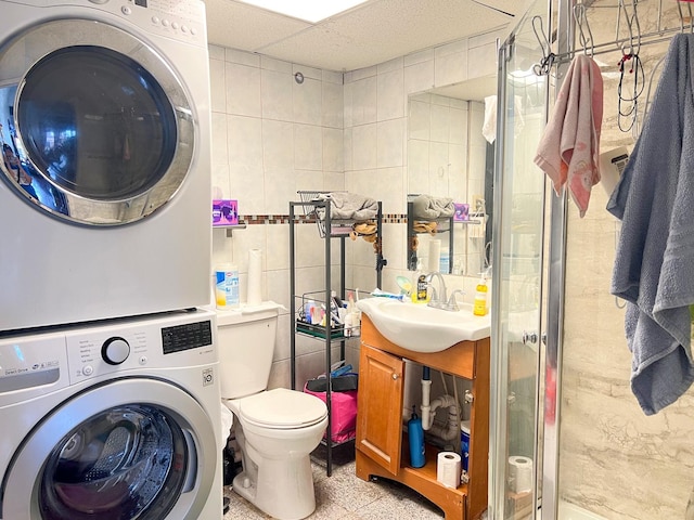 450 W 29th St, Chicago, IL 60616 - washroom with stacked washing machine and dryer and tile walls
