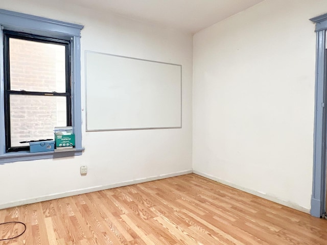 450 W 29th St, Chicago, IL 60616 - unfurnished room featuring wood finished floors and baseboards