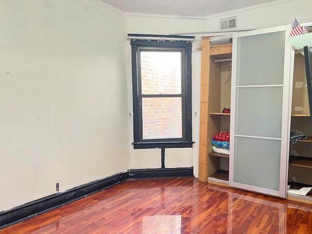 450 W 29th St, Chicago, IL 60616 - unfurnished bedroom with ornamental molding and wood finished floors