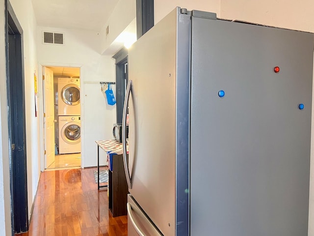 450 W 29th St, Chicago, IL 60616 - hallway featuring estacked washer and dryer and wood finished floors