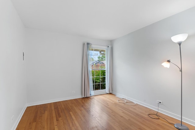 5475 Adeline Pl, Oak Forest, IL 60452 - unfurnished room featuring light wood finished floors and baseboards