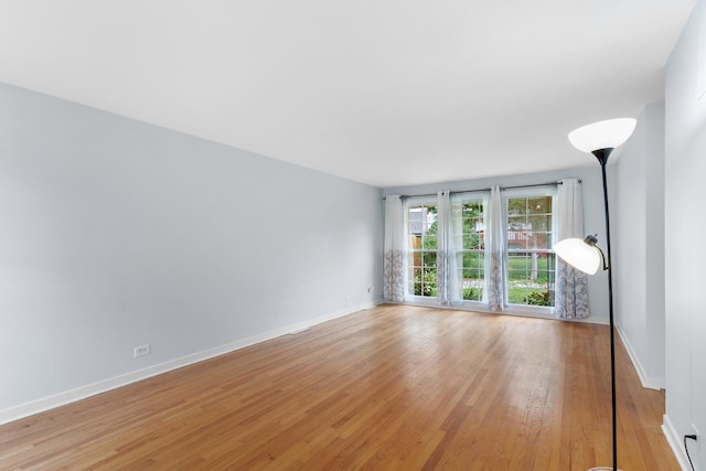 5475 Adeline Pl, Oak Forest, IL 60452 - spare room featuring light wood finished floors and baseboards