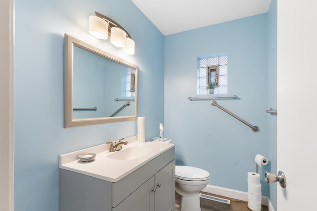 5475 Adeline Pl, Oak Forest, IL 60452 - bathroom with vanity, healthy amount of natural light, and wood finished floors