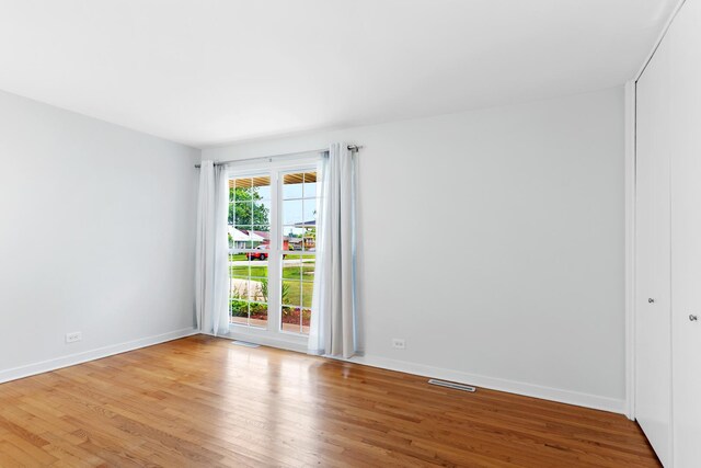 5475 Adeline Pl, Oak Forest, IL 60452 - empty room featuring light wood finished floors and baseboards