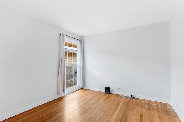 5475 Adeline Pl, Oak Forest, IL 60452 - empty room featuring baseboards and wood finished floors