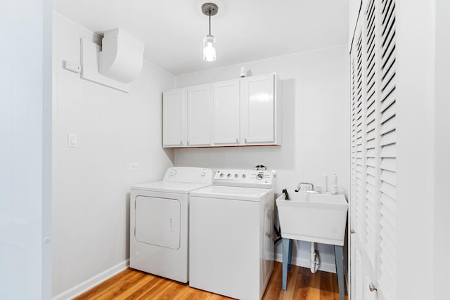 5475 Adeline Pl, Oak Forest, IL 60452 - laundry room with cabinet space, washer and clothes dryer, and light wood-style flooring