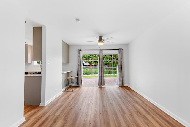 5475 Adeline Pl, Oak Forest, IL 60452 - unfurnished living room featuring light wood-type flooring and ceiling fan