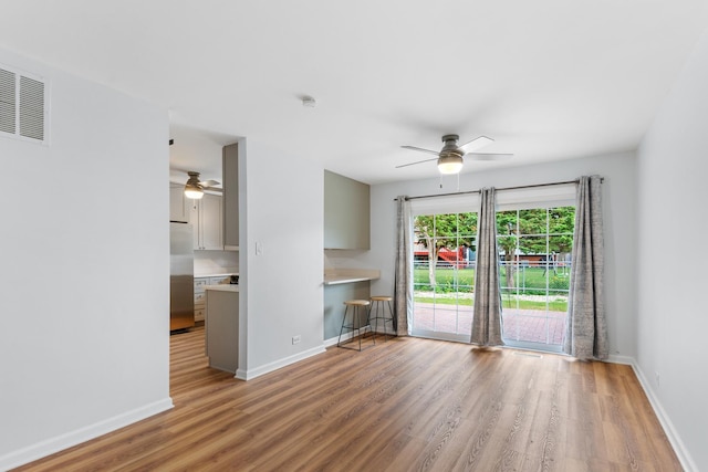 5475 Adeline Pl, Oak Forest, IL 60452 - unfurnished living room featuring ceiling fan and wood finished floors