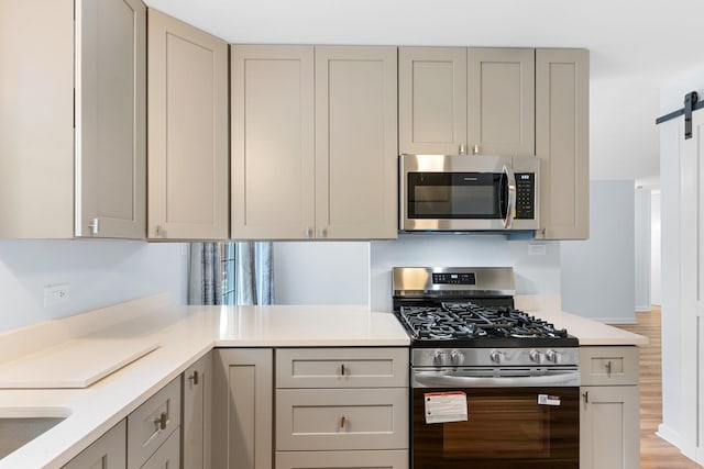 5475 Adeline Pl, Oak Forest, IL 60452 - kitchen featuring appliances with stainless steel finishes, gray cabinetry, and light countertops