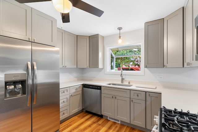 5475 Adeline Pl, Oak Forest, IL 60452 - kitchen featuring gray cabinets, appliances with stainless steel finishes, ceiling fan, and light countertops