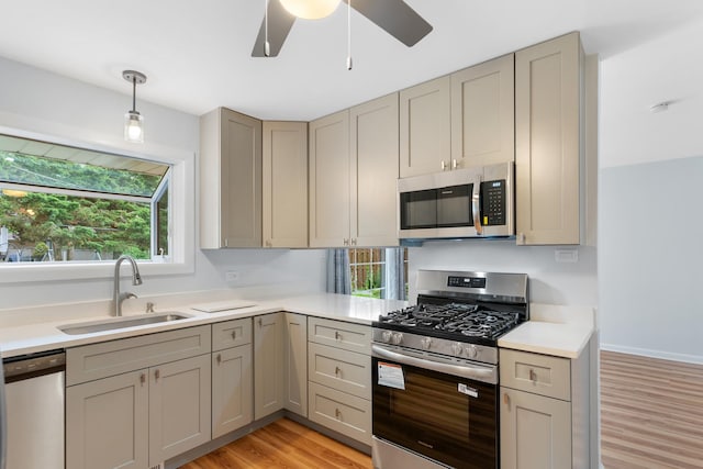 5475 Adeline Pl, Oak Forest, IL 60452 - kitchen featuring appliances with stainless steel finishes, gray cabinets, light wood-style floors, and light countertops
