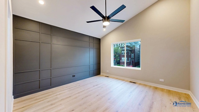 300 N Lockwood Ave, Chicago, IL 60644 - spare room featuring wood finished floors, a ceiling fan, a decorative wall, recessed lighting, and high vaulted ceiling