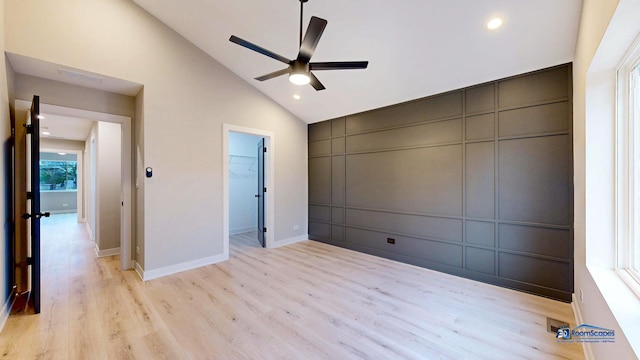 300 N Lockwood Ave, Chicago, IL 60644 - unfurnished bedroom with a decorative wall, vaulted ceiling, light wood-style flooring, recessed lighting, and ceiling fan