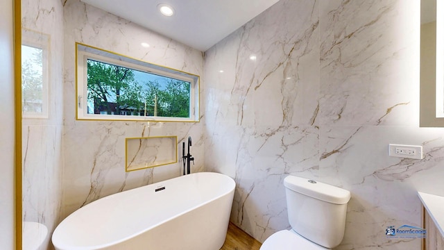 300 N Lockwood Ave, Chicago, IL 60644 - bathroom featuring a freestanding bath, tile walls, and vanity