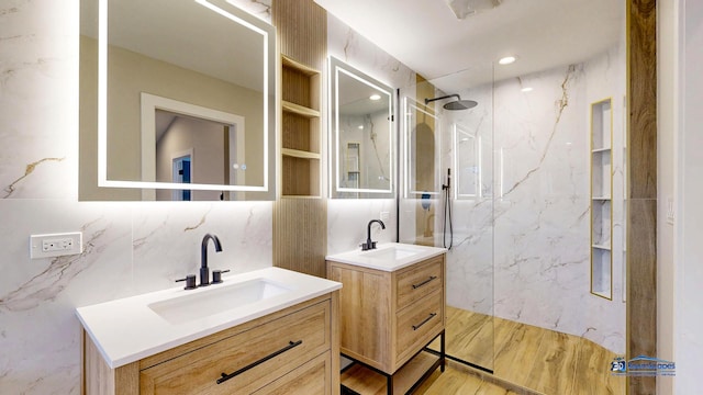 300 N Lockwood Ave, Chicago, IL 60644 - full bath featuring tile walls, a marble finish shower, and two vanities