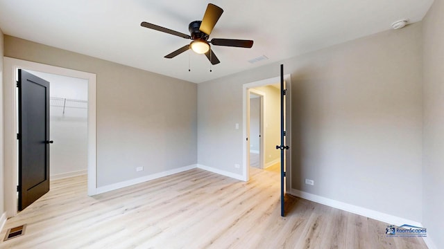 300 N Lockwood Ave, Chicago, IL 60644 - empty room featuring a smoke detector, light wood-type flooring, and a ceiling fan