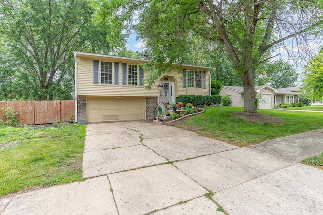 615 S 12th Ave, Saint Charles, IL 60174 - bi-level home with brick siding, an attached garage, and driveway