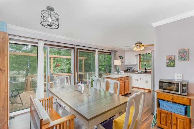 615 S 12th Ave, Saint Charles, IL 60174 - dining space with crown molding, plenty of natural light, a ceiling fan, and light wood-style floors
