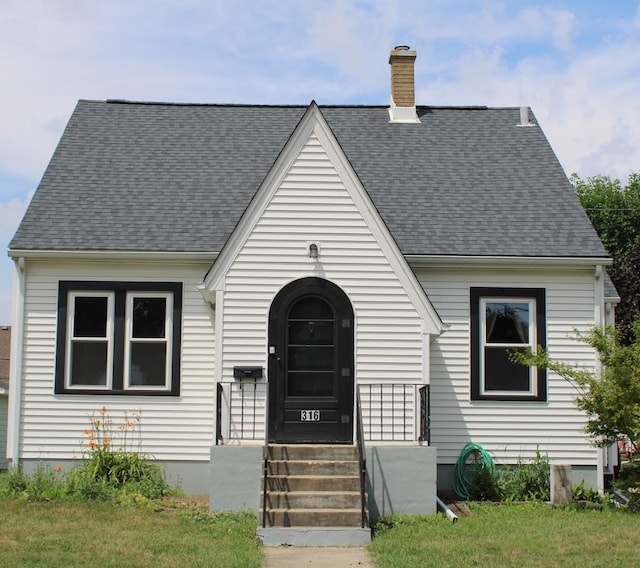 316 Marguerite St, Elgin, IL 60123 - view of front of property featuring a chimney and a shingled roof