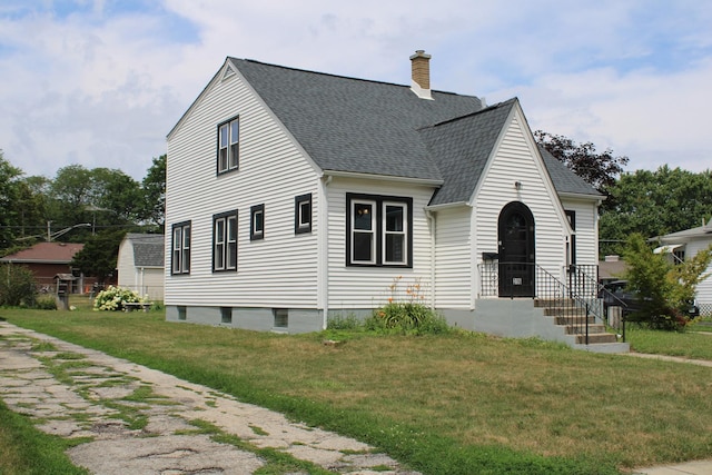316 Marguerite St, Elgin, IL 60123 - view of front of home with a chimney, a shingled roof, and a front lawn