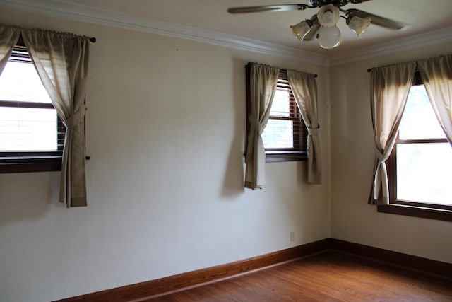 316 Marguerite St, Elgin, IL 60123 - unfurnished room with crown molding, a ceiling fan, and wood finished floors