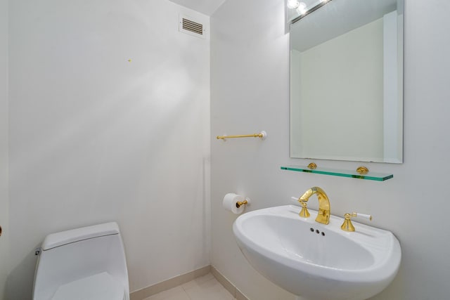360 E Randolph St Unit 503, Chicago, IL 60601 - half bathroom featuring a sink and tile patterned floors