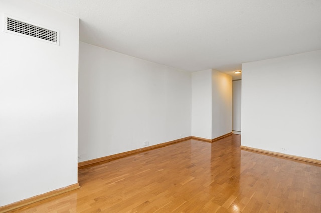360 E Randolph St Unit 503, Chicago, IL 60601 - unfurnished room with light wood-style floors and baseboards