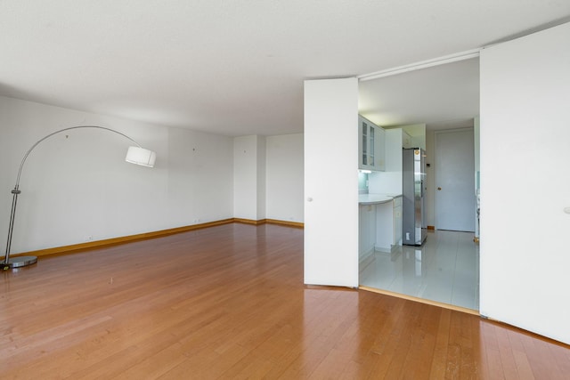 360 E Randolph St Unit 503, Chicago, IL 60601 - unfurnished room with light wood-style flooring and baseboards