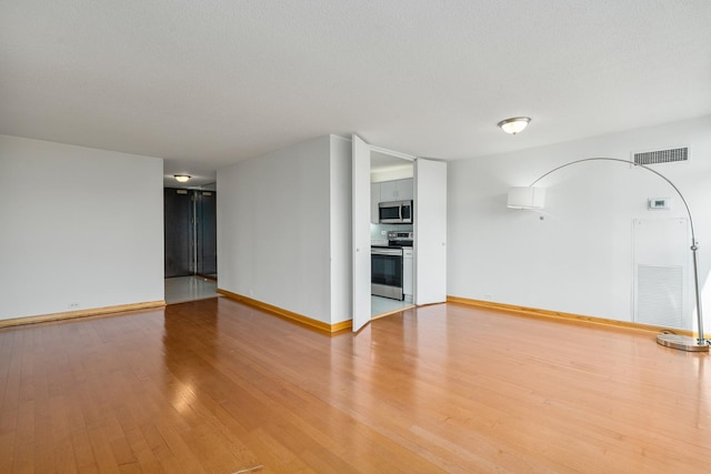 360 E Randolph St Unit 503, Chicago, IL 60601 - spare room with light wood-type flooring and baseboards