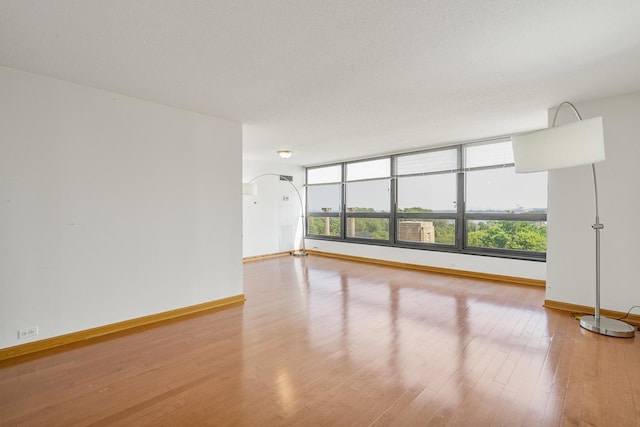 360 E Randolph St Unit 503, Chicago, IL 60601 - unfurnished room featuring wood finished floors and arched walkways