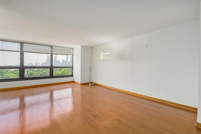 360 E Randolph St Unit 503, Chicago, IL 60601 - empty room with wood finished floors and baseboards